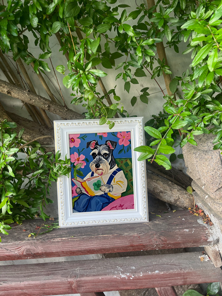 Schnauzer reading a book