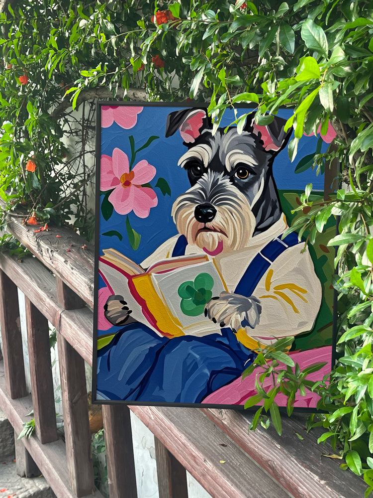 Schnauzer reading a book